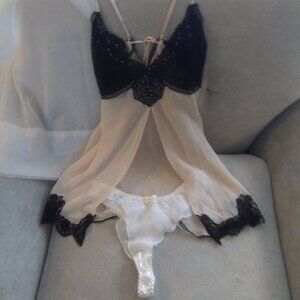 Saucy, pink and black nightie with white undies.